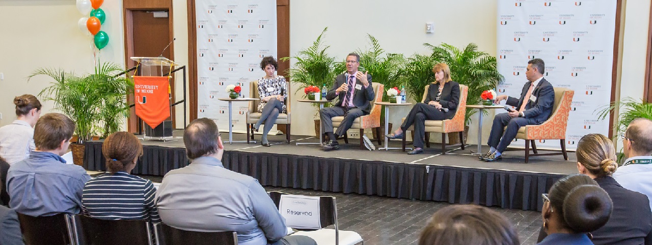 Senior Leaders in panel on stage